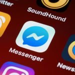 A detailed view of a smartphone screen displaying various app icons including Messenger and SoundHound. — Accelerate Your Soc