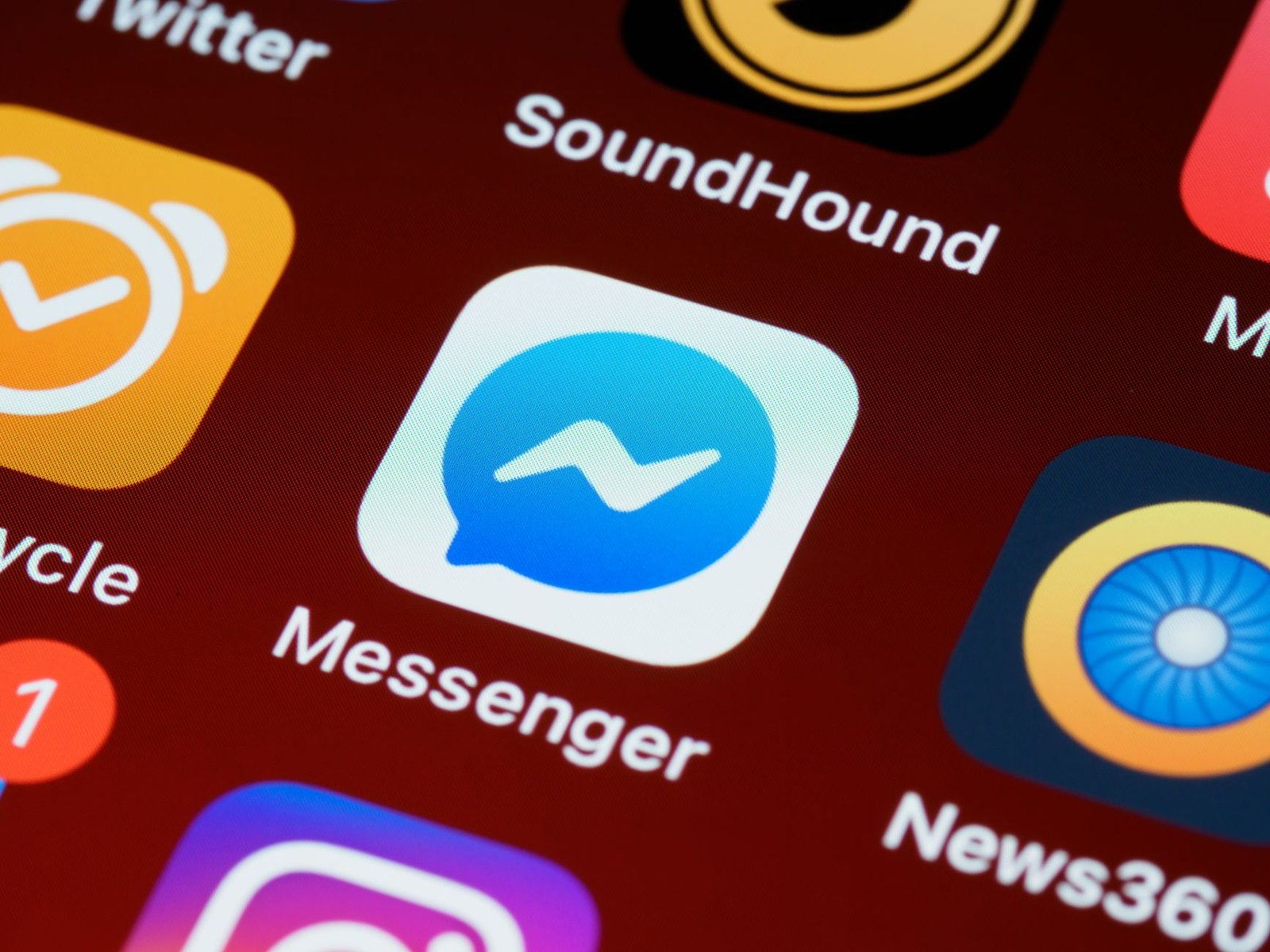 A detailed view of a smartphone screen displaying various app icons including Messenger and SoundHound. — Accelerate Your Soc