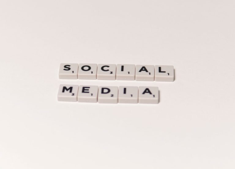 Scrabble tiles spelling 'social media' on a white background, representing digital communication concepts. — Boost Your Agenc