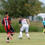 Two young soccer players competing during a match outdoors on a grassy field. — Enjoy Free NFL Streaming Options