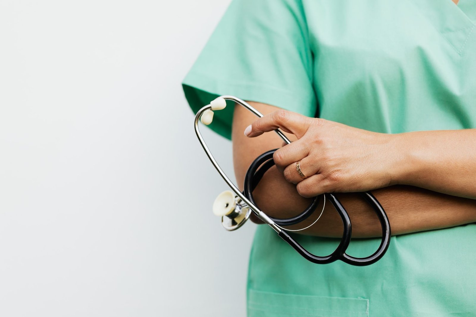 Close-up of a healthcare worker holding a stethoscope, showcasing medical professionalism. — Finding the Right TRT Doctor Nea