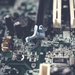 Detailed view of components on a computer motherboard, showcasing technology and circuitry. — Improving IT Governance with Ac