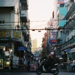 Colorful busy street scene in Cần Thơ, Vietnam with vibrant signs and people. — Why Valentine's Day Flowers Make the Perfect